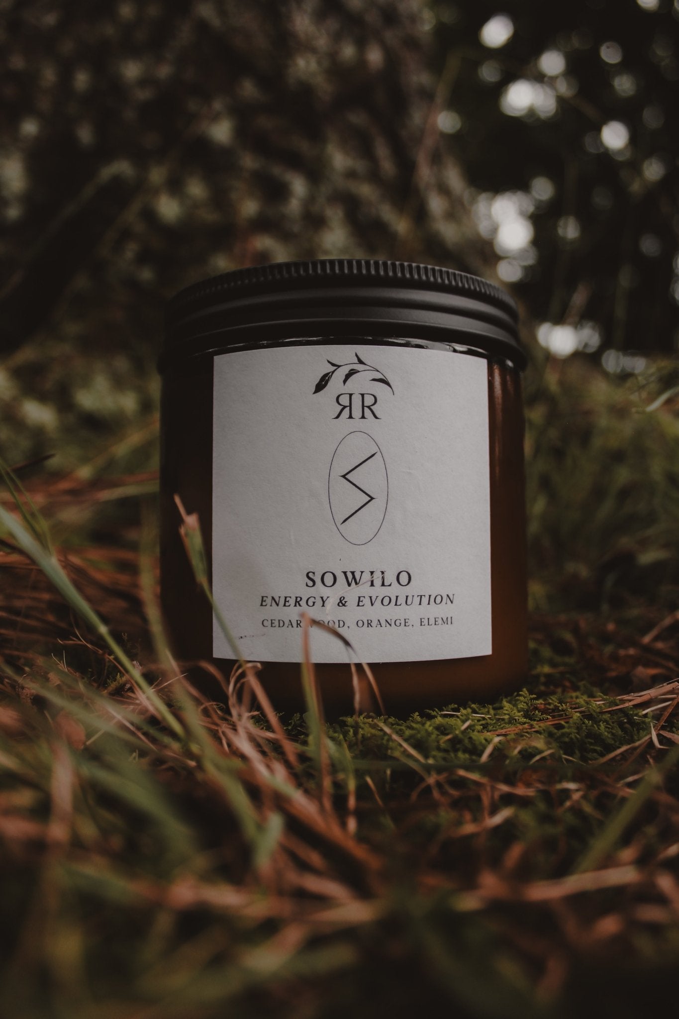 Sowilo Rune Candle, invigorating cedarwood orange elemi scent, glass jar, wooden wick.